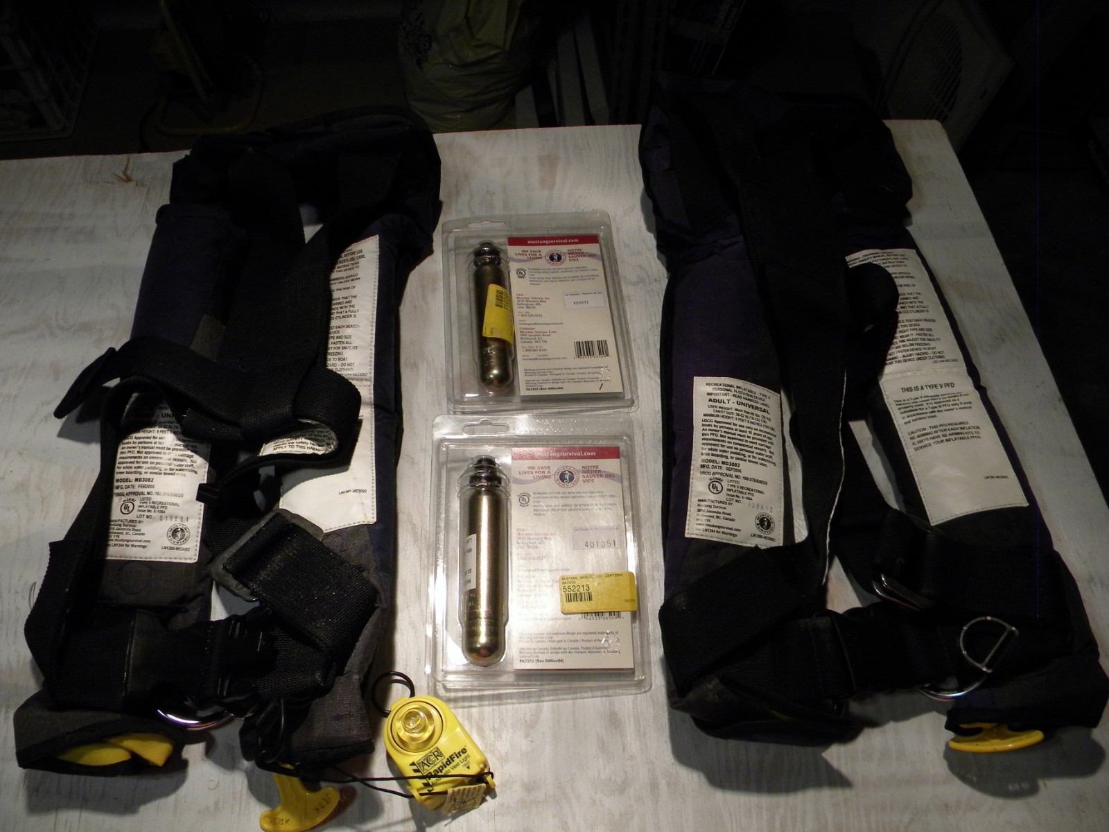 Pair MUSTANG deluxe inflatable PFD’s, with 2 rearm kits & 1 ACR attached strobe