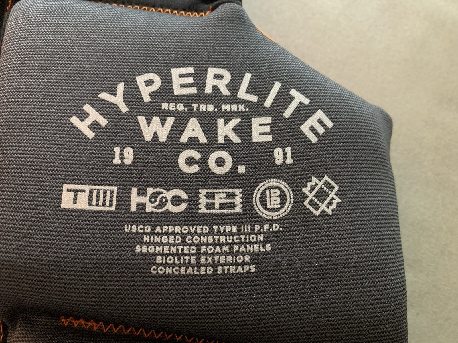 HYPERLITE Wake Co. Youth Life Vest Orange/Gray/Turq 55-88 lbs USCG Approved