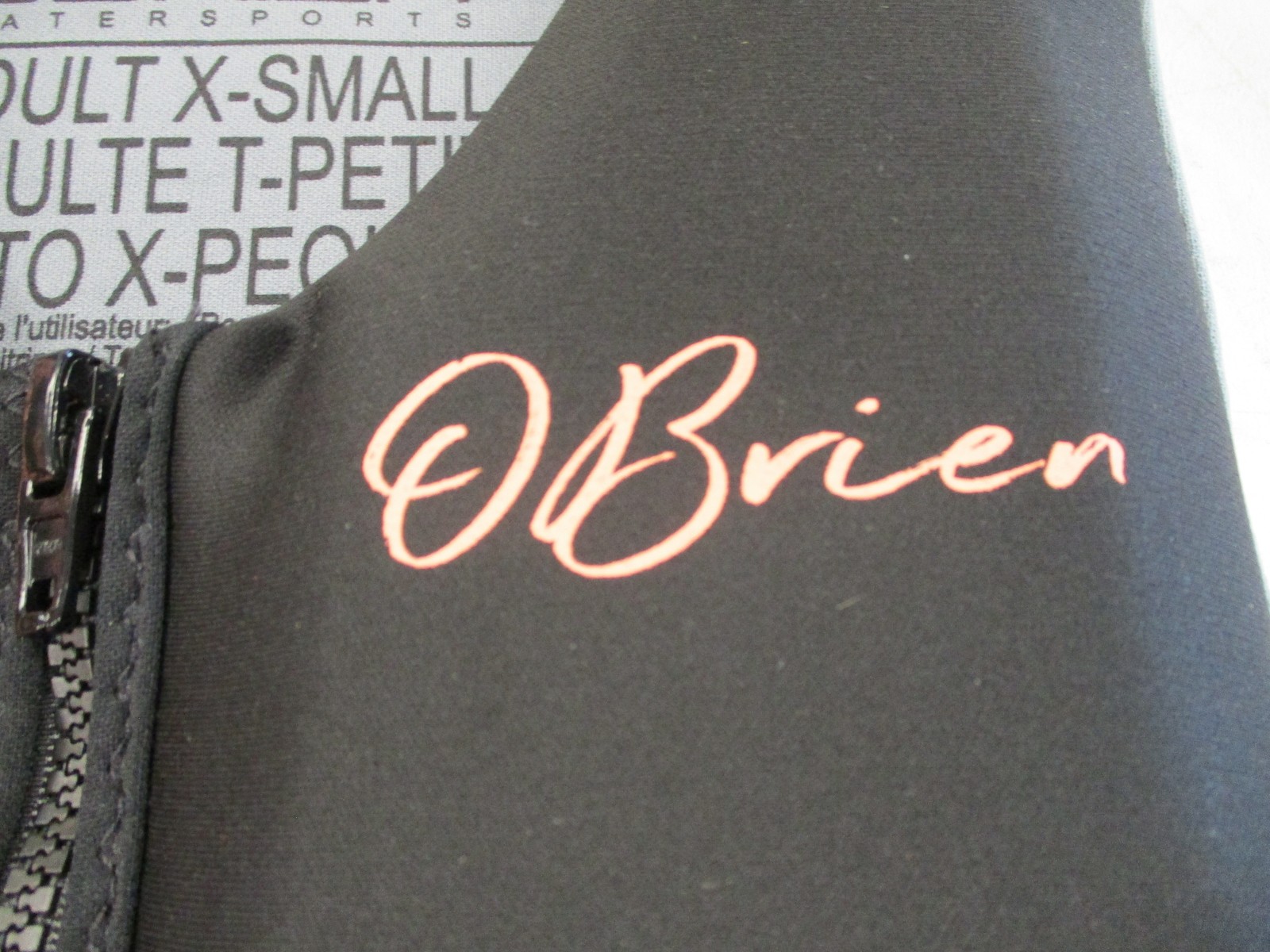 O’BRIEN WOMEN’S TRADITIONAL LIFE JACKET SIZE X-SMALL BLACK & CORAL 2231981